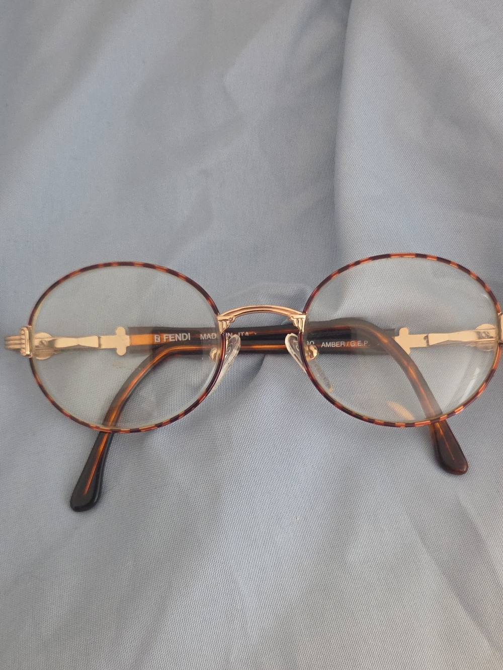 Fendi Men’s Rimless Glasses with Brown Temples and Gold Accents